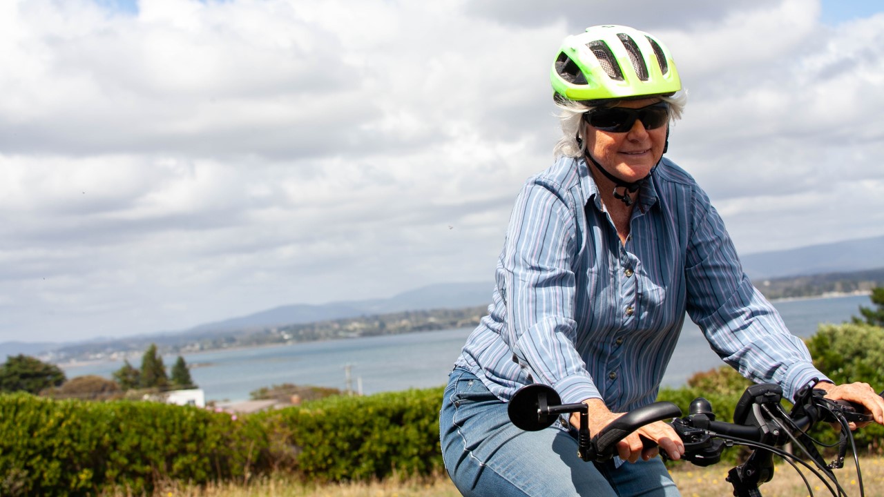 Older woman riding a bike