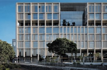 photo of exterior of corporate office with trees in front and beside it