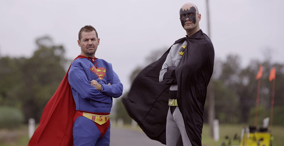 Ian and Scott during filming of their journey, dressed as Superman and Batman.