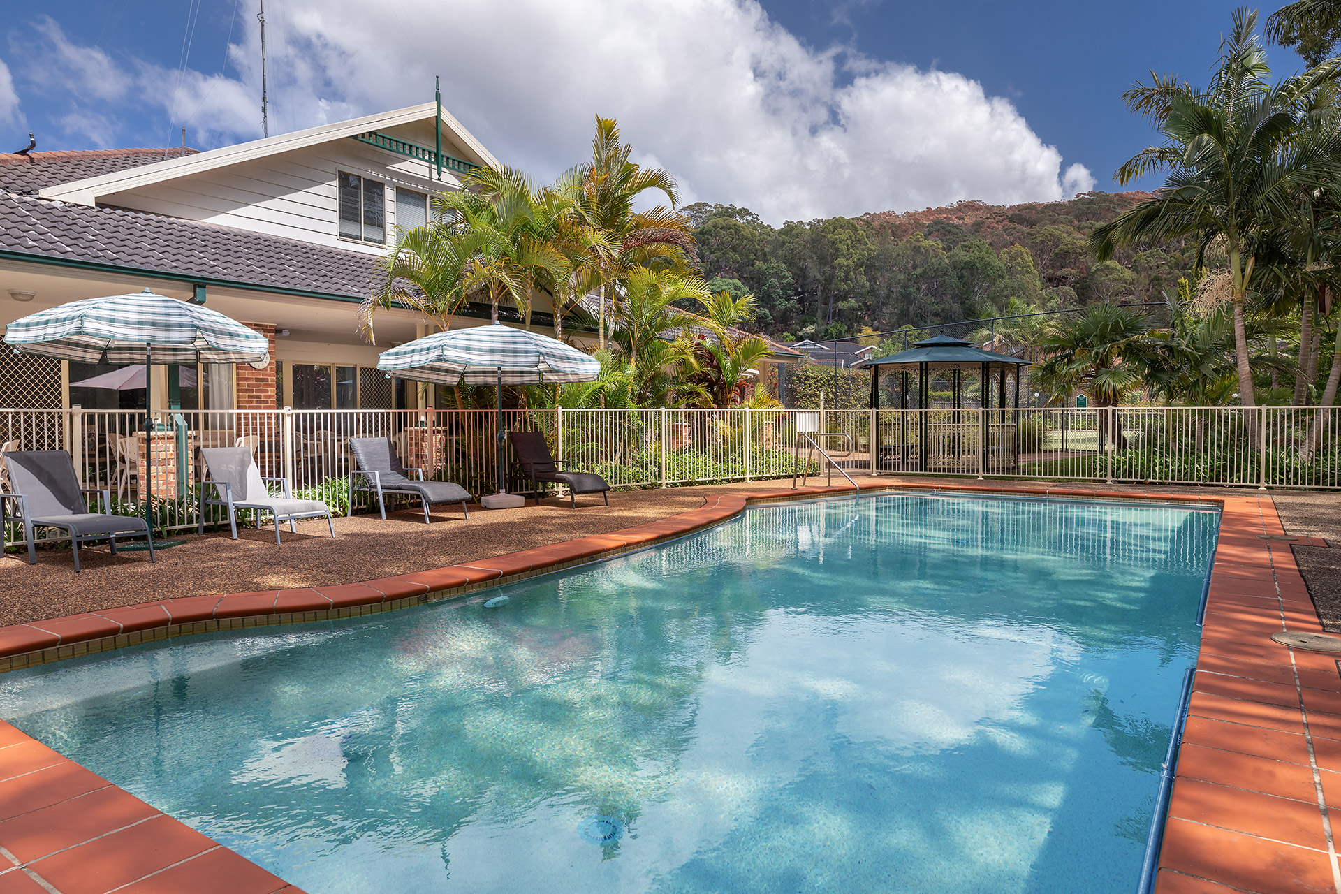 Clean outdoor pool with bushland views