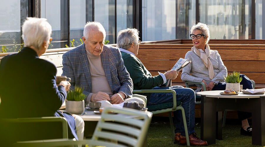 The Alba residents sitting outside