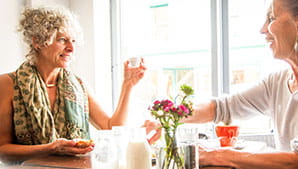 Image of two happy middle-aged ladies