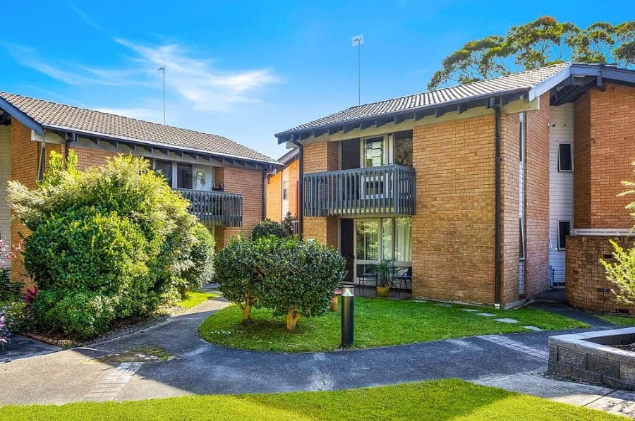 Karagi apartments surrounded by kept garden and lawn