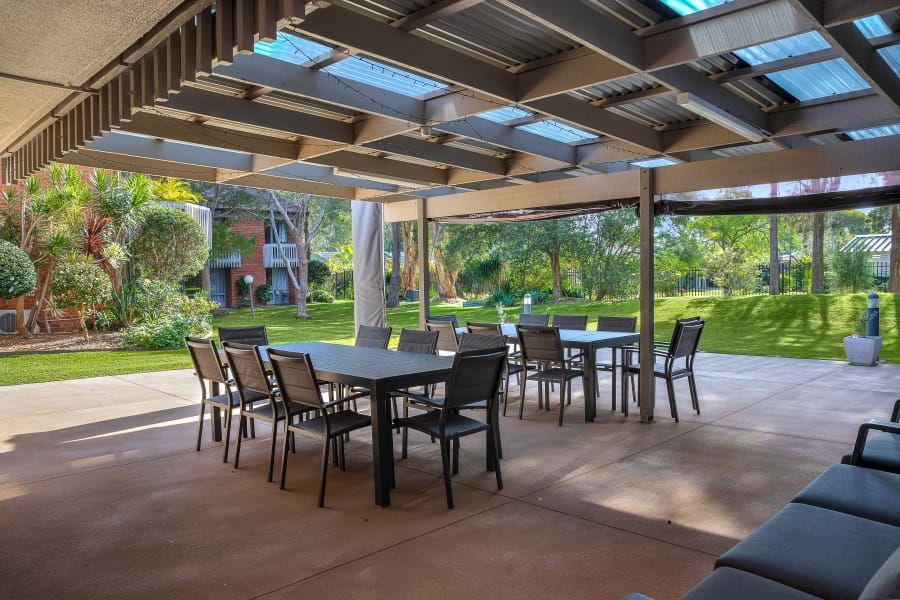 Outdoor eating area surrounded by trees