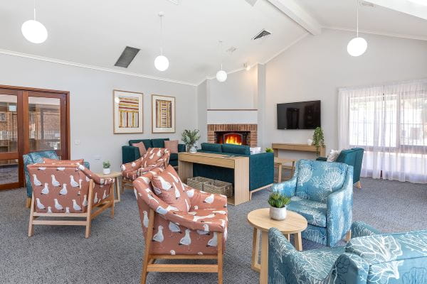 Lounge area with a lit fire place