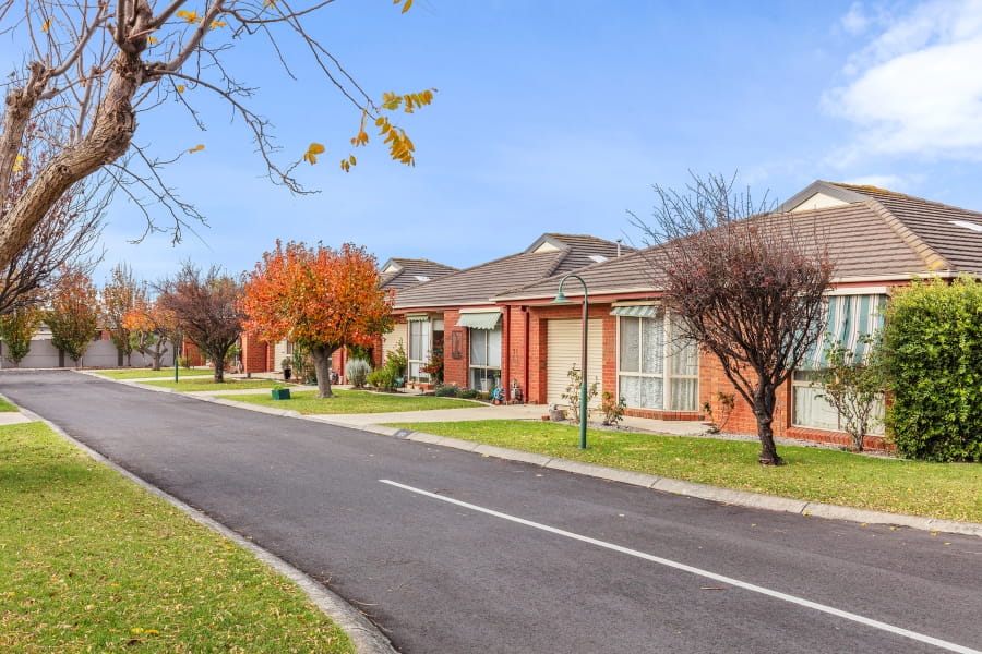 Modern red brick houses on a quiet road
