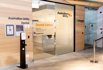 Glass doors entrance to Spring St dental clinic