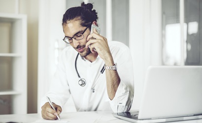 health professional taking phone call