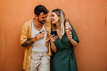 Couple laughing over icecream
