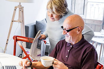 man and woman looking at laptop