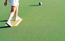 Person playing lawn bowls