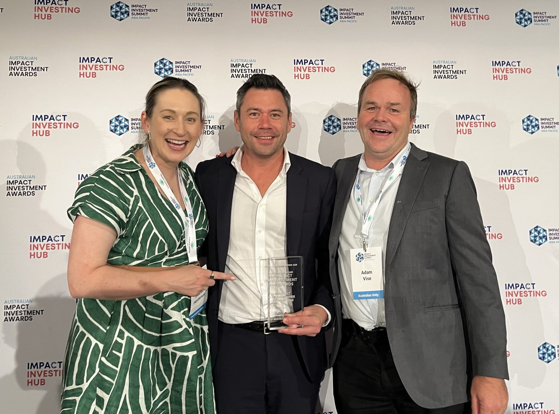 The Specialist Disability Accommodation Fund's three leads smiling with Impact Asset Owner of the Year award
