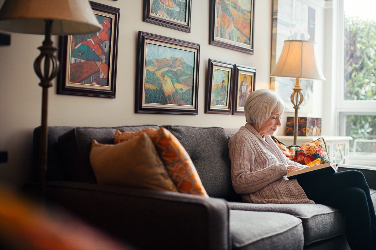 Older woman sitting on her couch