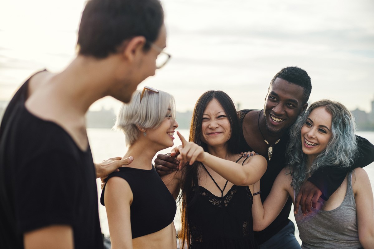 Group of smiling and laughing young men and women