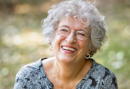 Older woman laughing and smiling to camera