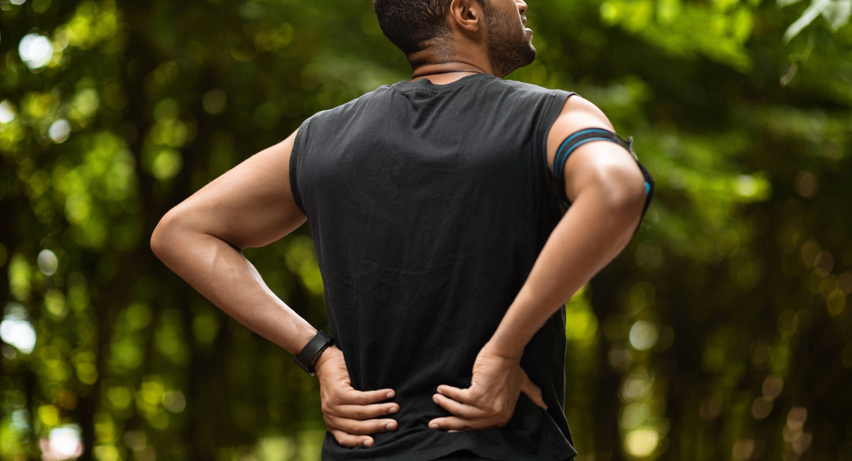 A man holding his back