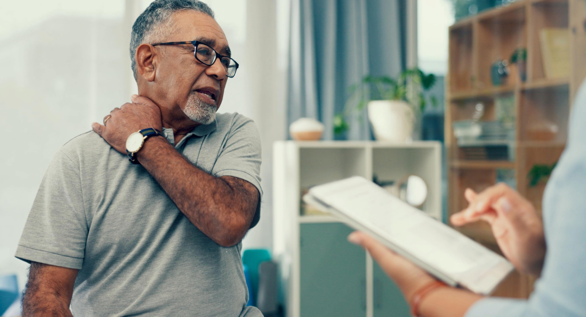 A man at a physiotherapist appointment