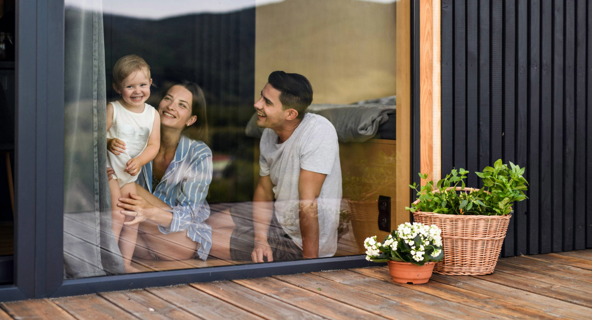 A young family sitting in their new home