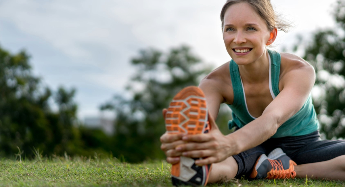 A women stretching in work-out clothes