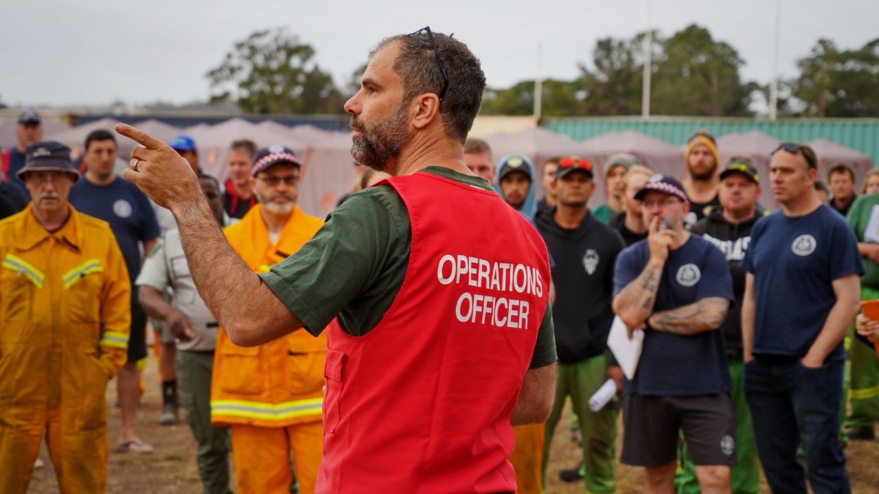 CFA Officer addressing crowd of residents