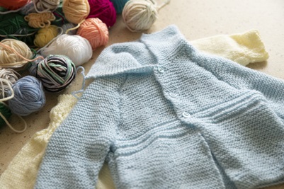 A pale blue jacket knitted by Norma