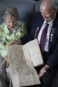 Stanley with wife Carole looking over a map