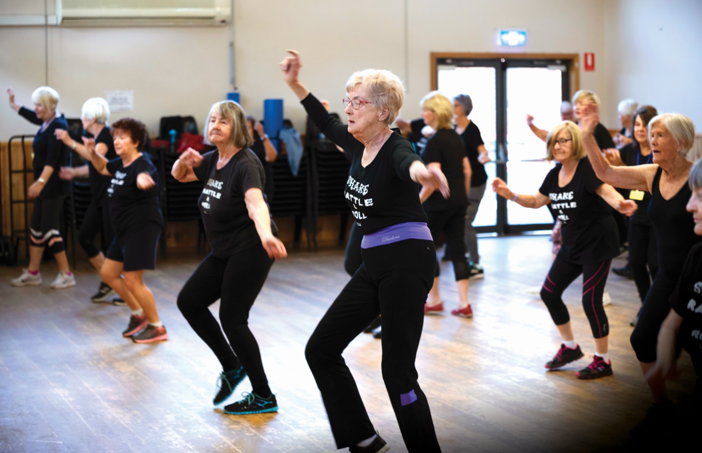 Helen Gordon leading a group dance class.