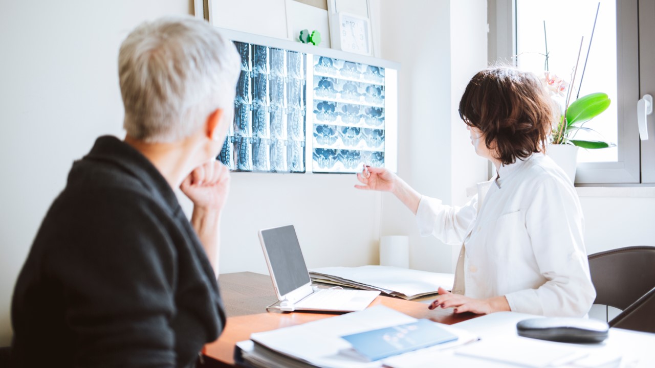 Older woman and doctor discussing X-Rays