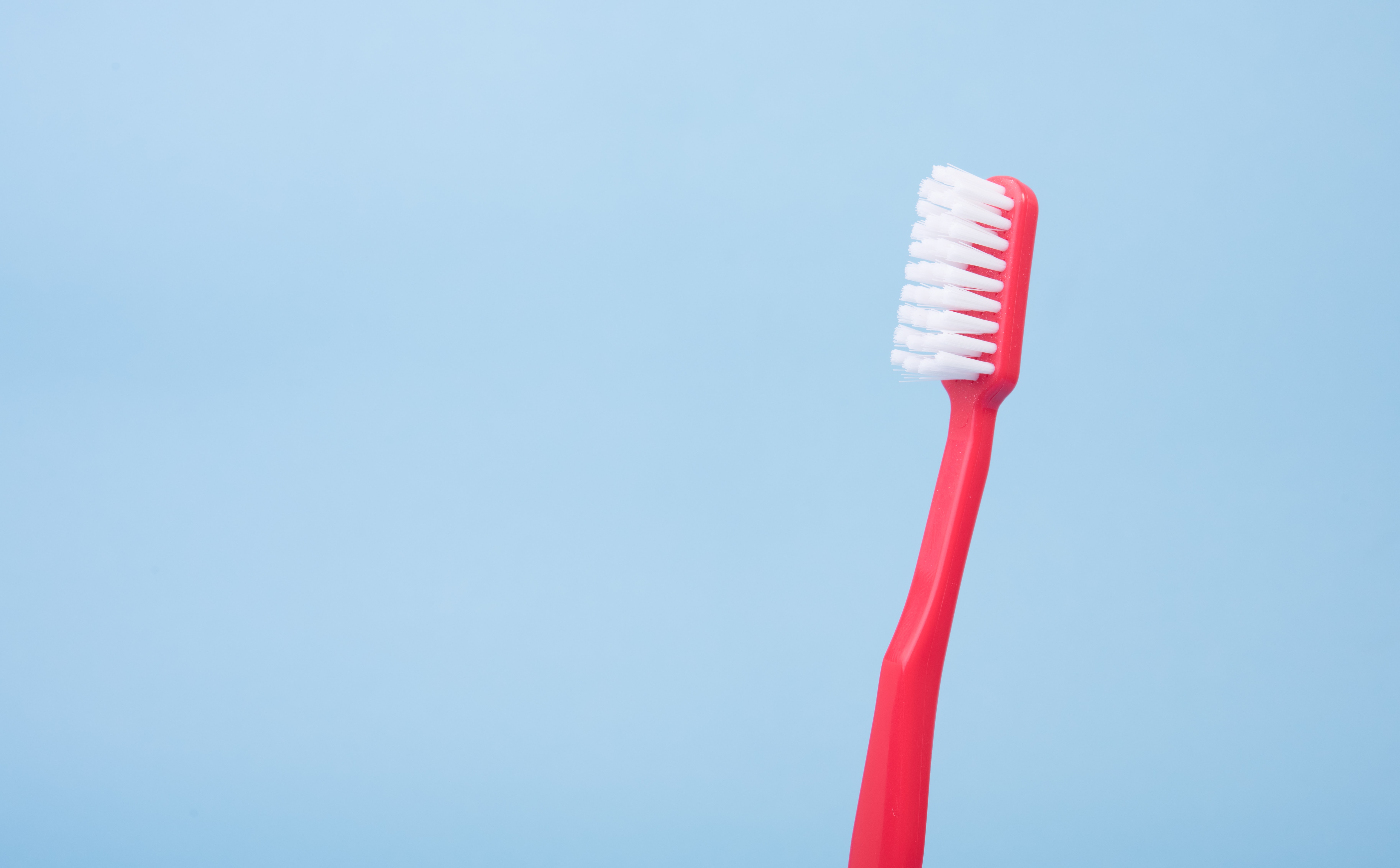Red handle toothbrush