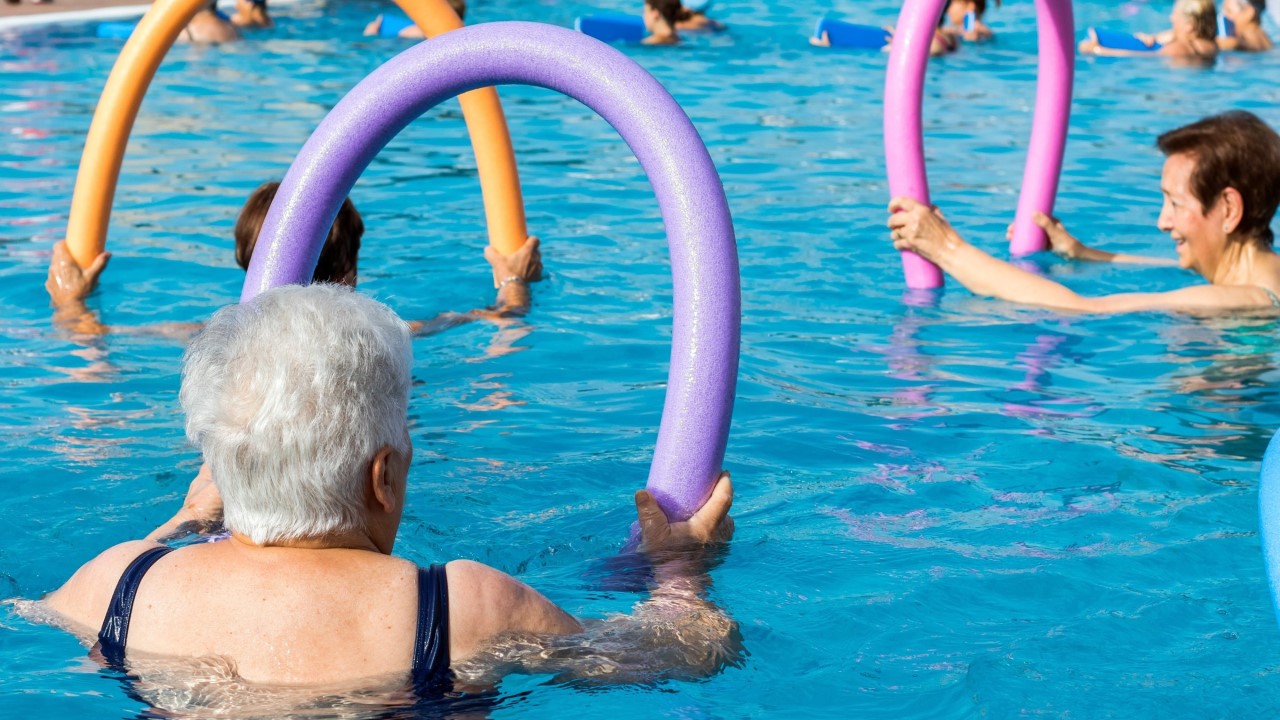 Older woman doing water aerobics