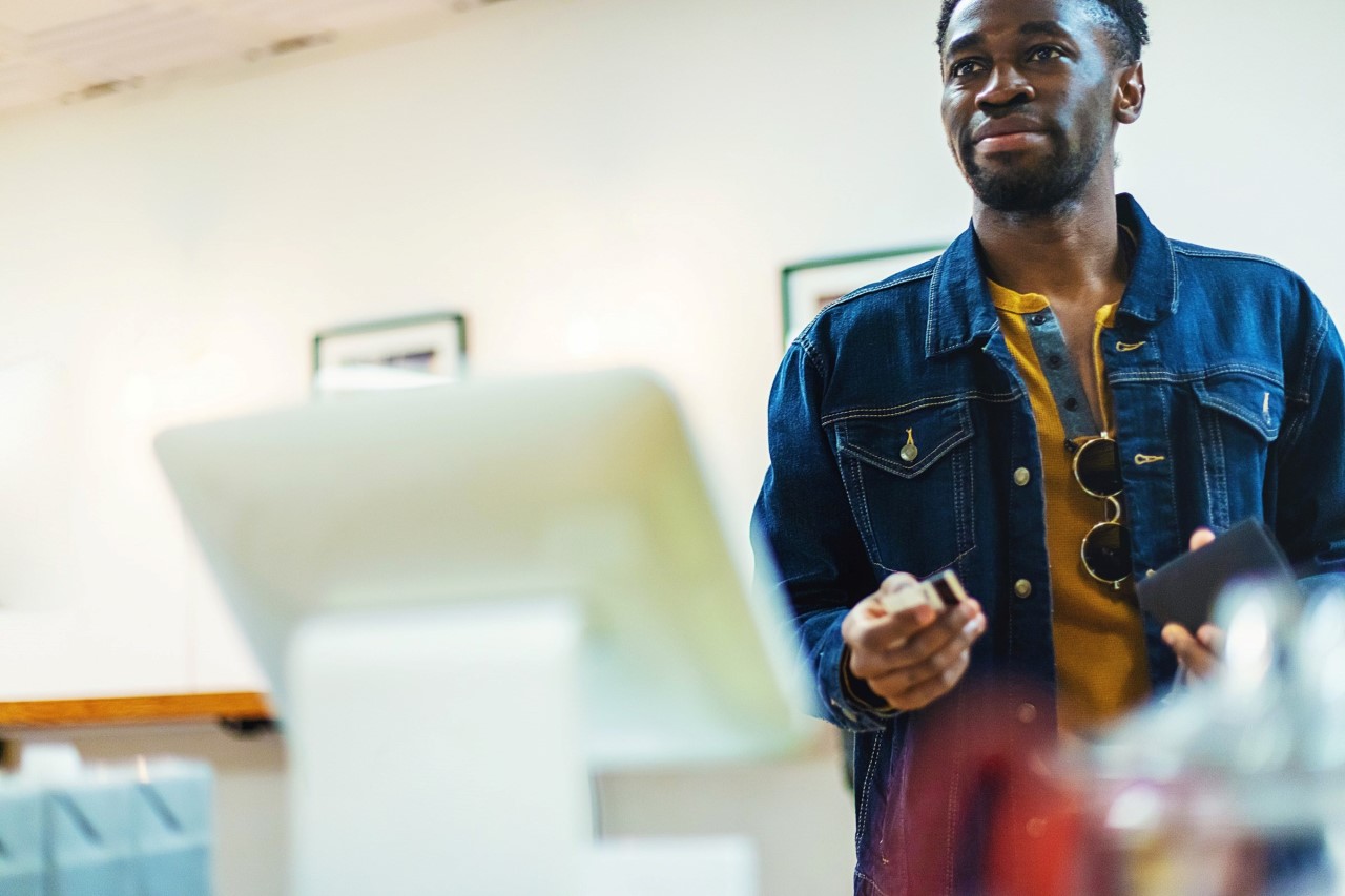 Man about to pay with eftpos card