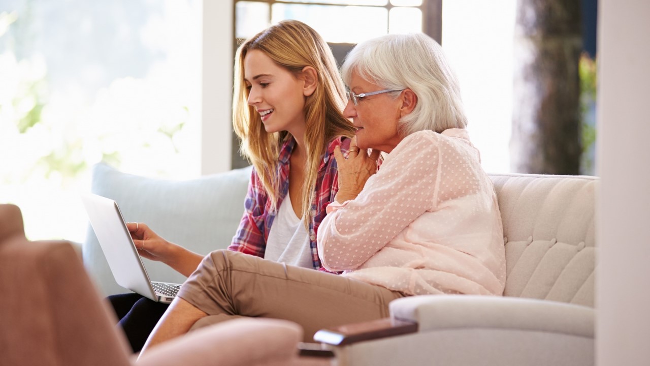 Young woman and older woman looking at a laptop screen