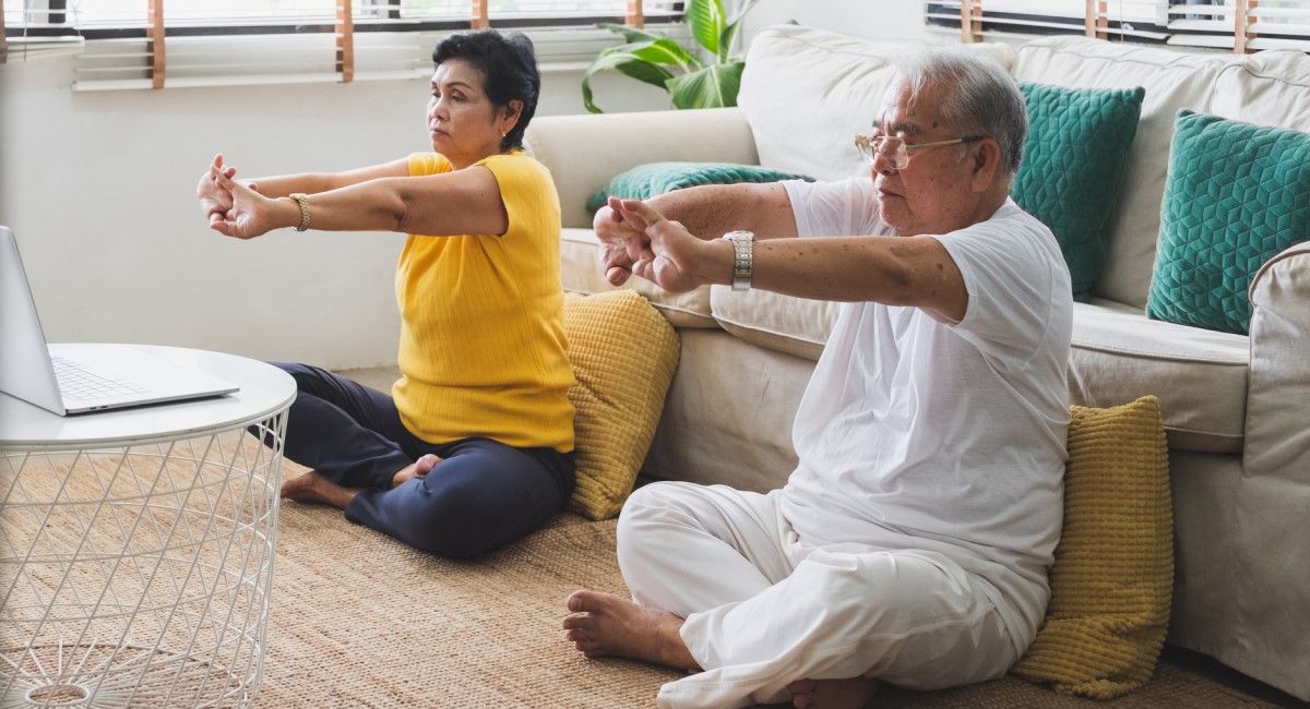 people doing yoga at home via computer