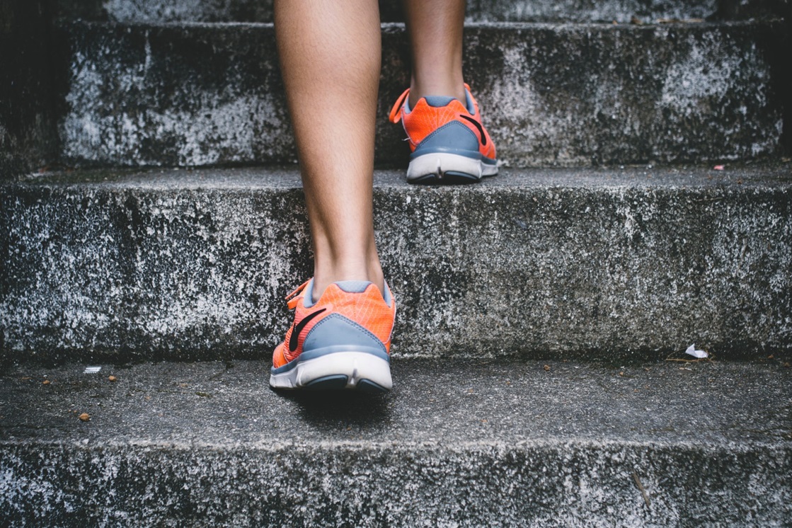 Picture of woman's running shoes as she exercises on stairs