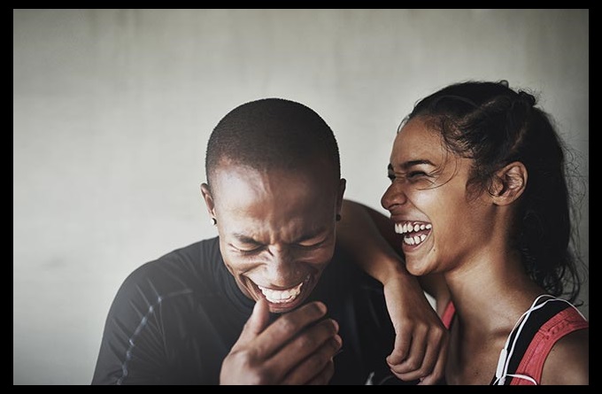 Happy man and woman laughing