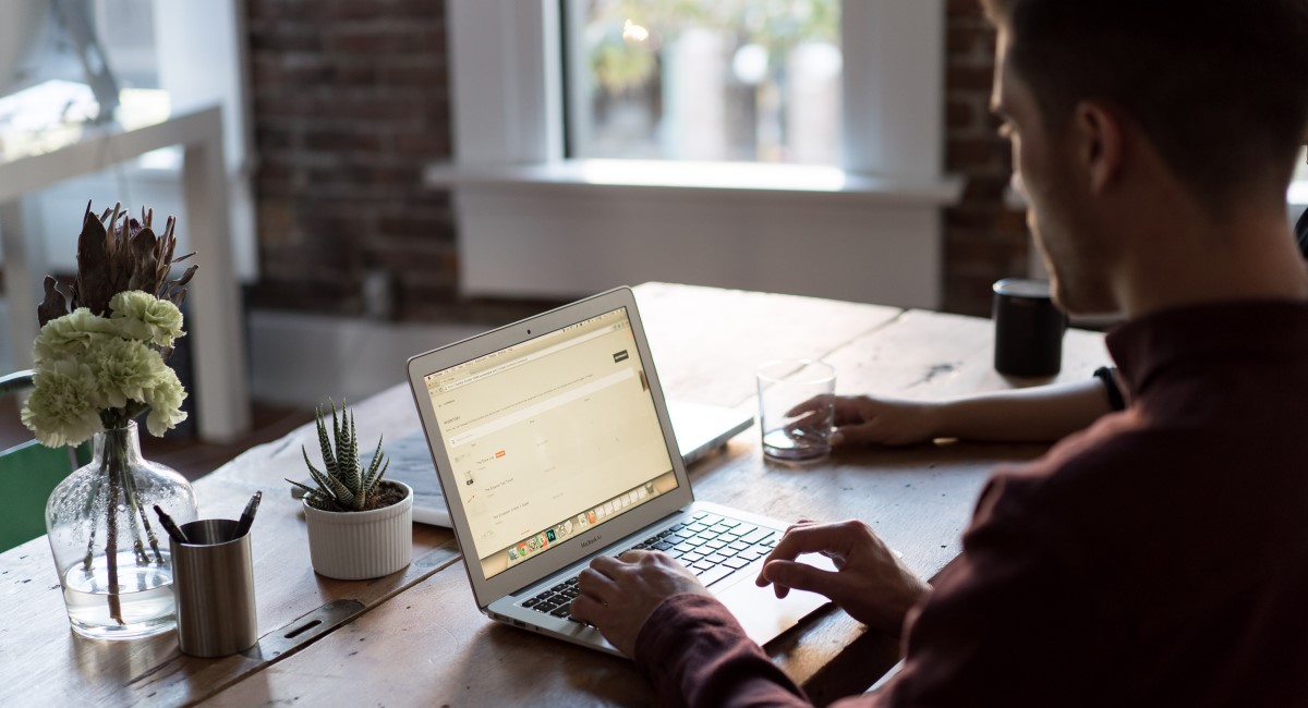 Man looking at laptop screen