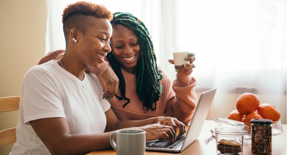 Two women looking at laptop