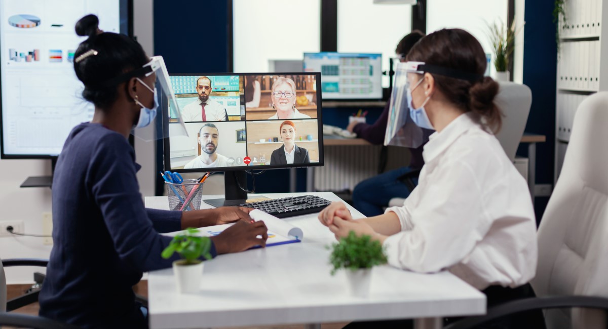 Workers on a Zoom meeting