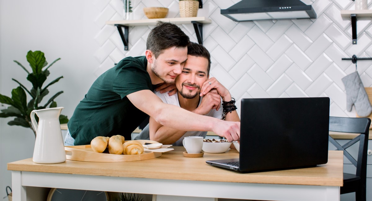 Male couple looking at laptop