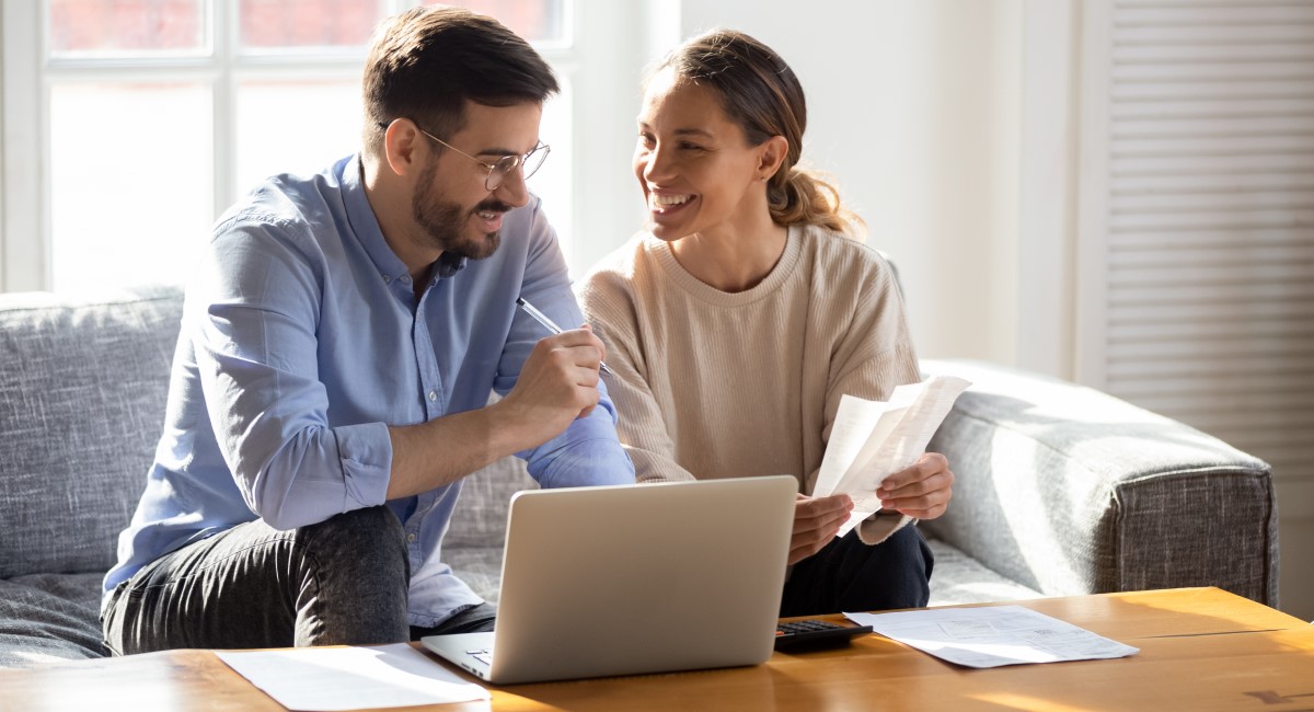 Man and woman looking at a laptop screen