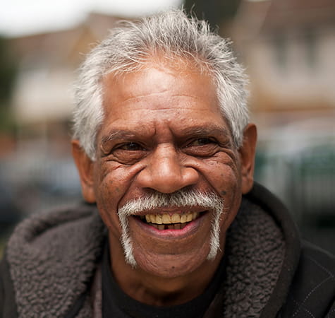 Indigenous man smiling at the camera