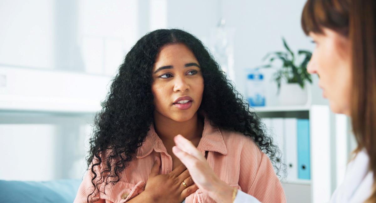A young woman speaking to a doctor