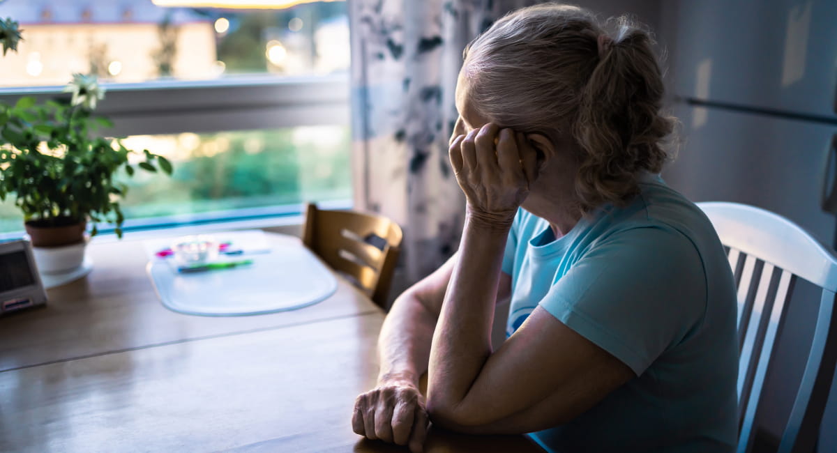 A depressed woman looking out a window
