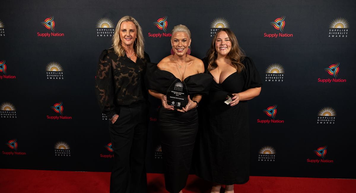 Three women from Printing With Purpose with an award at the 2024 Supply Nation Awards