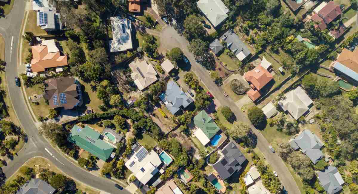 A view of suburban houses and streets from above