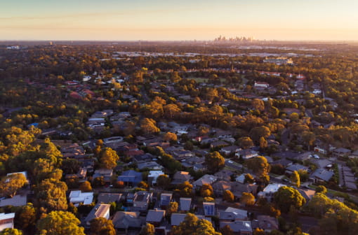 A view over suburbs with the city in the distance