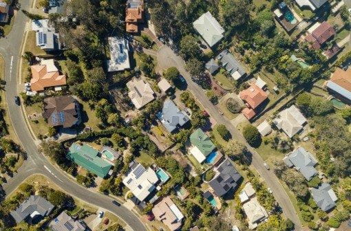 A view of suburban houses and streets from above