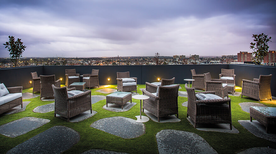 Terrace at dawn with outdoor chairs and tables