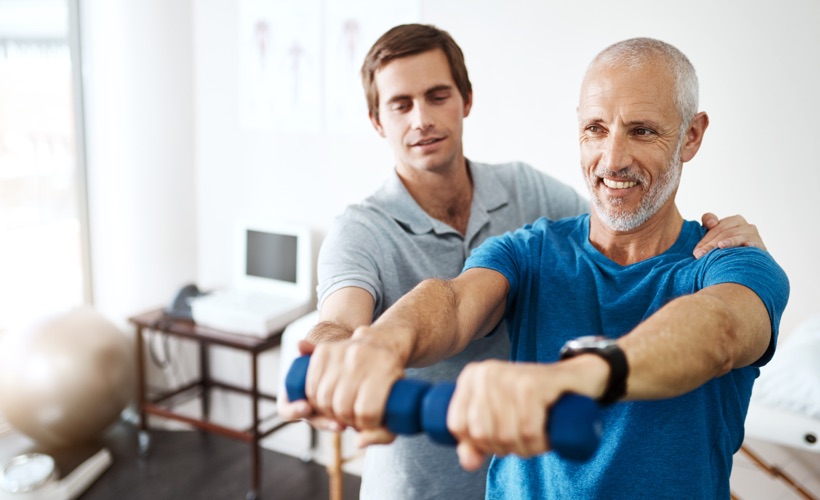 Man exercising with his physiotherapist